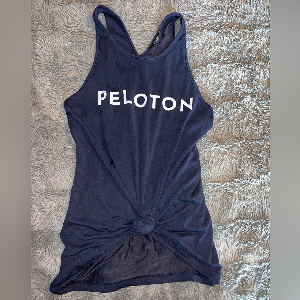 NUX peloton small tank. Tie up front and crisscross straps in the back.